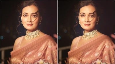 Styled by fashion stylist Theia Tekchandaney, Dia wore her tresses into a messy bun as she posed for the photoshoot. (Instagram/@diamirzaofficial) Styled by fashion stylist Theia Tekchandaney, Dia wore her tresses into a messy bun as she posed for the photoshoot. (Instagram/@diamirzaofficial)