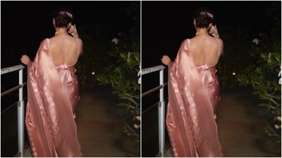 Dia teamed her saree with a matching pastel pink sleeveless blouse with knot details at the back. (Instagram/@diamirzaofficial) Dia teamed her saree with a matching pastel pink sleeveless blouse with knot details at the back. (Instagram/@diamirzaofficial)