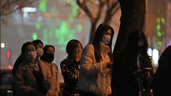 Residents line up for Covid-19 tests on the street of Beijing, China on Sunday. (AP)