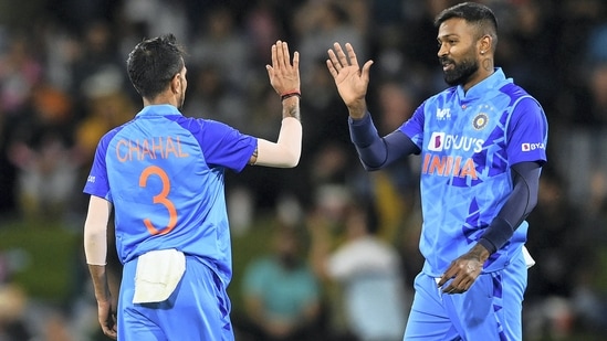 Hardik Pandya celebrates with Yuzvendra Chahal the wicket of Jimmy Neesham (AP)