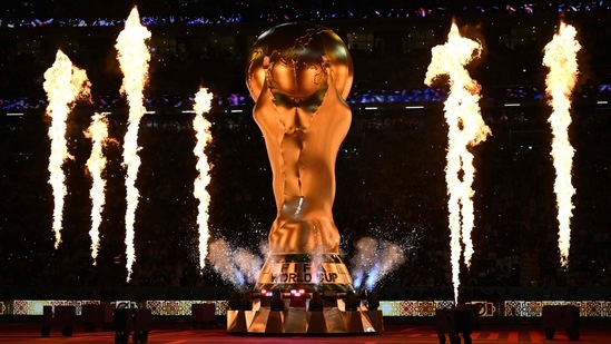Fireworks explode around a replica of the FIFA World Cup trophy during the opening ceremony of the Qatar 2022 World Cup. (AFP)