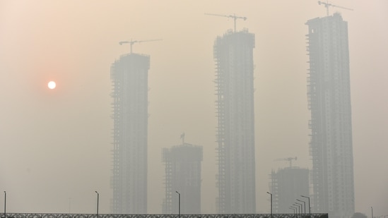 A view of skyscrapers engulfed in dense smog amid rising air pollution levels, in Noida, India. Doctors reveal the impact of air pollution on our mental health (Photo by Sunil Ghosh/ Hindustan Times )