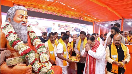 Bharatiya Janata Party national president JP Nadda offers prayers to the statue of Maharshi Valmiki during an event, in Ballari on Sunday. (Agencies)