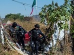 Guanajuato: Police officers protect members of the "Hasta Encontrarte" ("Until we find you") collective during the search. Guanajuato: Police officers protect members of the "Hasta Encontrarte" ("Until we find you") collective during the search.