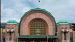 The Helsinki Central Railway Station that features two statues on either side The Helsinki Central Railway Station that features two statues on either side