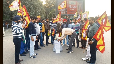 Members of the Democratic Teachers Front Ludhiana unit protesting outside the District Administrative Complex on Monday.