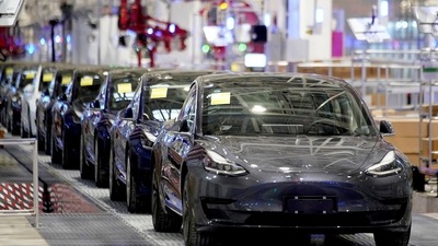 Tesla China-made Model 3 vehicles are seen during a delivery event at its factory in Shanghai. (REUTERS)