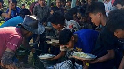 The Bangladeshi people fled their villages and entered Siminasora village in Mizoram’s southernmost Lawngtlai district on Sunday. (Sourced) The Bangladeshi people fled their villages and entered Siminasora village in Mizoram’s southernmost Lawngtlai district on Sunday. (Sourced)