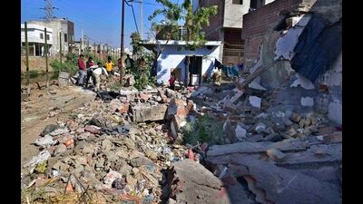 A portion of the building that was razed by the civic body in Ludhiana on Monday.