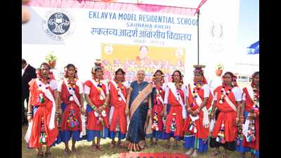 UP governor Anandiben Patel with Tharu women at EMRS, Saunha on Monday. (ht poto)