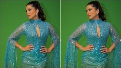 Sunny decked up in the blue sequined gown with turtle neck details and a cut-out detail at the neckline. The gown featured dramatic long sleeves that cascaded down till her ankles featuring frills. (Instagram/@sunnyleone)