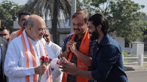 Gujarat 2022 election: Amit Shah and cricketer Ravindra Jadeja at the airport in Jamnagar. Jadeja's wife, Rivaba, is a party candidate from this Assembly constituency. (Source: ANI)