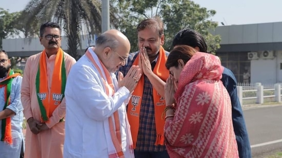 Gujarat 2022 election: Amit Shah and Rivaba Jadeja, and India cricketer Ravindra Jadeja at the Jamnagar airport (Source: ANI)