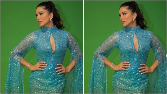 Sunny decked up in the blue sequined gown with turtle neck details and a cut-out detail at the neckline. The gown featured dramatic long sleeves that cascaded down till her ankles featuring frills.(Instagram/@sunnyleone)