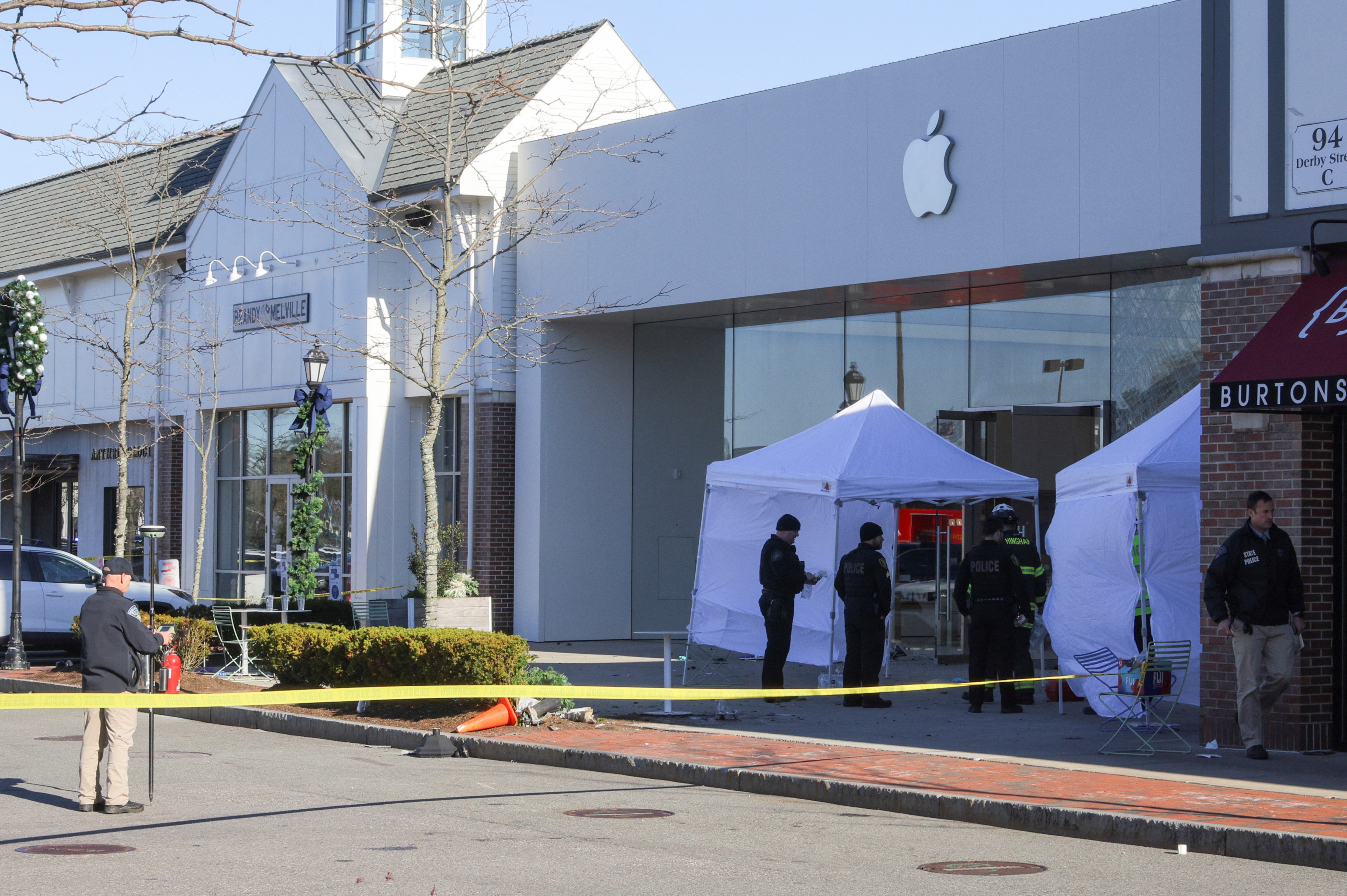 Emergency services personnel attend the scene after a vehicle crashed into an Apple store in Hingham, Massachusetts. (REUTERS)