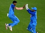 India's Mohammed Siraj (left) celebrates the wicket of New Zealand's Mitchell Santner(AP) India's Mohammed Siraj (left) celebrates the wicket of New Zealand's Mitchell Santner(AP)