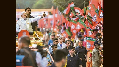 Prime Minister Narendra Modi during a roadshow in Rajkot. (PTI) Prime Minister Narendra Modi during a roadshow in Rajkot. (PTI)