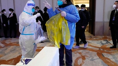 Covid In China: Health workers collect swab samples from the environment before a session for the Financial Street Forum 2022 held in Beijing. (AP) Covid In China: Health workers collect swab samples from the environment before a session for the Financial Street Forum 2022 held in Beijing. (AP)