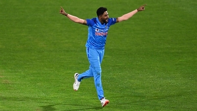 Mohammed Siraj celebrates the wicket of Mitchell Santner during the T20I in Napier (AP) Mohammed Siraj celebrates the wicket of Mitchell Santner during the T20I in Napier (AP)