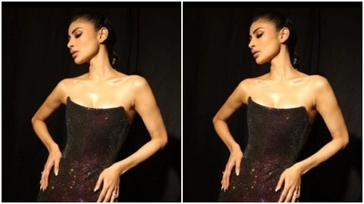 Mouni's off-shoulder gown featured a long train at the back, and bodycon details as it hugged Mouni's shape perfectly and showed off her curves. (Instagram/@imouniroy) Mouni's off-shoulder gown featured a long train at the back, and bodycon details as it hugged Mouni's shape perfectly and showed off her curves. (Instagram/@imouniroy)