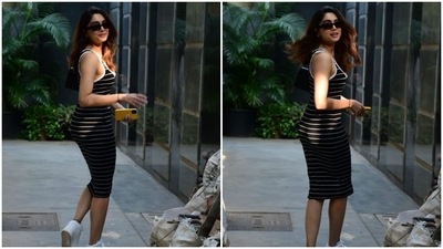 For the occasion, Sharvari picked a fitted sleeveless dress. It comes adorned in a black and white horizontal striped print and features broad straps, a plunging U neckline accentuating her décolletage, a figure-hugging silhouette highlighting her frame, and a midi-length hem. (HT Photo/Varinder Chawla) For the occasion, Sharvari picked a fitted sleeveless dress. It comes adorned in a black and white horizontal striped print and features broad straps, a plunging U neckline accentuating her décolletage, a figure-hugging silhouette highlighting her frame, and a midi-length hem. (HT Photo/Varinder Chawla)