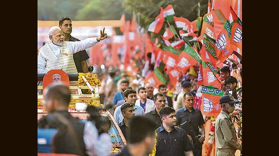 Prime Minister Narendra Modi during a roadshow in Rajkot. (PTI)