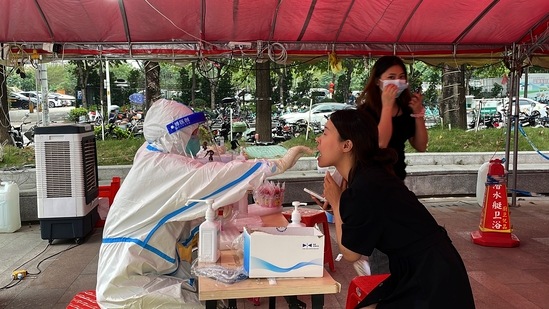 Covid In China: A resident gets swabbed for COVID test in Guangzhou.(AP) Covid In China: A resident gets swabbed for COVID test in Guangzhou.(AP)