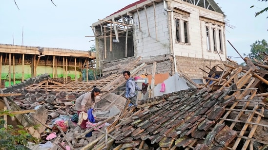 Indonesia Earthquake: Earthquake survivors collect usable items from the ruins of their house in Cianjur.(AP)