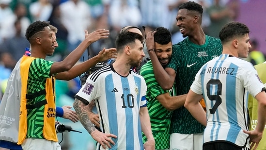 Lusail: Argentina's Lionel Messi standing beside Saudi Arabia's players celebrating after winning the World Cup group C match (AP)