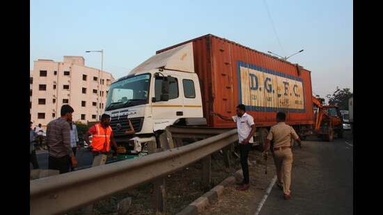 A truck rammed into a car near Navle Bridge on Tuesday. (Ravindra Joshi/HT PHOTO)