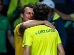 Australia's Alex de Minaur, front, is hugged by team Captain Lleyton Hewitt after defeating Netherland's Botic van de Zandschulp during a Davis Cup quarter-final tennis match between Australia and The Netherlands in Malaga, Spain, Tuesday, Nov. 22, 2022. (AP Photo/Joan Monfort)(AP) Australia's Alex de Minaur, front, is hugged by team Captain Lleyton Hewitt after defeating Netherland's Botic van de Zandschulp during a Davis Cup quarter-final tennis match between Australia and The Netherlands in Malaga, Spain, Tuesday, Nov. 22, 2022. (AP Photo/Joan Monfort)(AP)