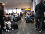 People walk through Newark Liberty International Airport on the day before one of the busiest travel days of the year.(Getty Images via AFP) People walk through Newark Liberty International Airport on the day before one of the busiest travel days of the year.(Getty Images via AFP)