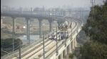 The rapid rail bridge and the rapid rail line over the Hindon river in Ghaziabad have been installed and the workers of the rapid rail are working on the electric poles, in Ghaziabad on November 19. (Sakib Ali/HT Photo) The rapid rail bridge and the rapid rail line over the Hindon river in Ghaziabad have been installed and the workers of the rapid rail are working on the electric poles, in Ghaziabad on November 19. (Sakib Ali/HT Photo)