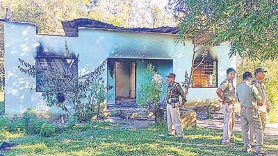 Security personnel near a forest office, in Assam’s West Karbi Anglong, which was vandalised by miscreants on Tuesday. (PTI) Security personnel near a forest office, in Assam’s West Karbi Anglong, which was vandalised by miscreants on Tuesday. (PTI)