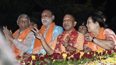 Uttar Pradesh chief minister Yogi Adityanath during a road show in Surat for the Gujarat assembly election campaign. (ANI PHOTO) Uttar Pradesh chief minister Yogi Adityanath during a road show in Surat for the Gujarat assembly election campaign. (ANI PHOTO)