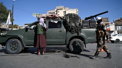 Afghanistan: Taliban fighters stand guard as they block a road near Kabul. (AFP) Afghanistan: Taliban fighters stand guard as they block a road near Kabul. (AFP)