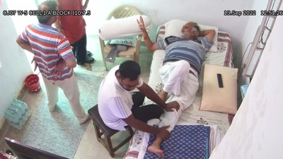 A CCTV video shows jailed Delhi minister Satyendar Jain getting a massage inside Tihar Jail, in New Delhi on Saturday. (ANI ) A CCTV video shows jailed Delhi minister Satyendar Jain getting a massage inside Tihar Jail, in New Delhi on Saturday. (ANI )