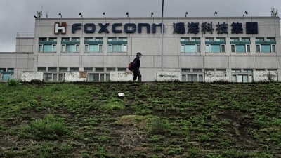 Foxconn China Violence: A man walking past the Foxconn headquarters. (AFP)