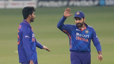 India's Venkatesh Iyer, left celebrates with India's captain Rohit Sharma (AP) India's Venkatesh Iyer, left celebrates with India's captain Rohit Sharma (AP)