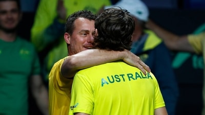 Australia's Alex de Minaur, front, is hugged by team Captain Lleyton Hewitt after defeating Netherland's Botic van de Zandschulp during a Davis Cup quarter-final tennis match between Australia and The Netherlands in Malaga, Spain, Tuesday, Nov. 22, 2022. (AP Photo/Joan Monfort) (AP) Australia's Alex de Minaur, front, is hugged by team Captain Lleyton Hewitt after defeating Netherland's Botic van de Zandschulp during a Davis Cup quarter-final tennis match between Australia and The Netherlands in Malaga, Spain, Tuesday, Nov. 22, 2022. (AP Photo/Joan Monfort) (AP)