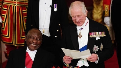 King Charles III:  South Africa's President Cyril Ramaphosa listens as Britain's King Charles III speaks during a State Banquet. (AFP)