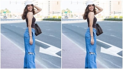 Sharvari wore a dark brown-coloured sleeveless crop top featuring thin straps, a quirky slogan on the front, a fitted silhouette, and a cropped hem length. She teamed the top with distressed denim jeans. (Instagram) Sharvari wore a dark brown-coloured sleeveless crop top featuring thin straps, a quirky slogan on the front, a fitted silhouette, and a cropped hem length. She teamed the top with distressed denim jeans. (Instagram)