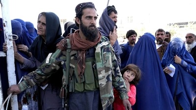 A Taliban fighter stands guard as people receive food rations distributed by a Saudi humanitarian aid group, in Kabul, Afghanistan, Monday, April. (AP file) A Taliban fighter stands guard as people receive food rations distributed by a Saudi humanitarian aid group, in Kabul, Afghanistan, Monday, April. (AP file)