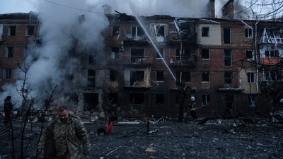 Rescuers work at a site of a residential building destroyed by a Russian missile attack, as Russia's attack on Ukraine continues, in the town of Vyshhorod, near Kyiv, Ukraine, Wednesday. (REUTERS)