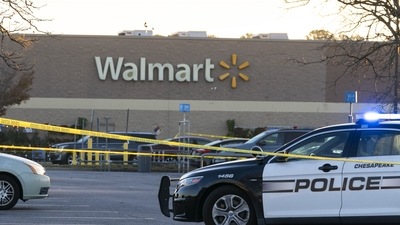 Law enforcement work the scene of a mass shooting at a Walmart, Wednesday in US state of Virginia. (AP ) Law enforcement work the scene of a mass shooting at a Walmart, Wednesday in US state of Virginia. (AP )