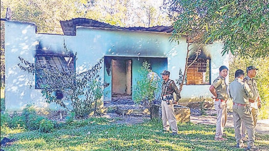 Security personnel near a forest office, in Assam’s West Karbi Anglong, which was vandalised by miscreants on Tuesday. (PTI)