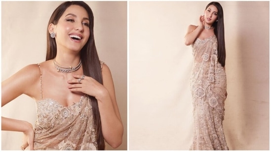Nora Fatehi often makes headlines for her sartorial fashion choices. She is known to make heads turn every time she steps out in fancy fits. Recently, she left the internet ablaze with her latest photoshoot pictures in a shimmery ivory lehenga saree.(Instagram/@norafatehi)