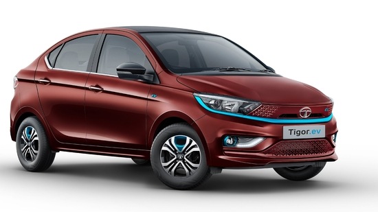 Tata Tigor EV will be sold in a new colour scheme called Magnetic Red. It also gets blue accents. Tata Tigor EV will be sold in a new colour scheme called Magnetic Red. It also gets blue accents.