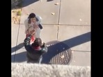 The 60-second video shows the the man and the woman standing on the pavement in what seems to be a residential neighbourhood.