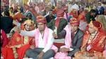 In the mass marriage ceremony of the Labour Department at Ghaziabad's Kamla Nehru Nagar ground, 3,000 couples were married on Thursday. Uttar Pradesh's Labour Minister Anil Rajbhar performed the ceremony with Union Minister VK Singh in attendance. (Sakib Ali /HT Photo) In the mass marriage ceremony of the Labour Department at Ghaziabad's Kamla Nehru Nagar ground, 3,000 couples were married on Thursday. Uttar Pradesh's Labour Minister Anil Rajbhar performed the ceremony with Union Minister VK Singh in attendance. (Sakib Ali /HT Photo)